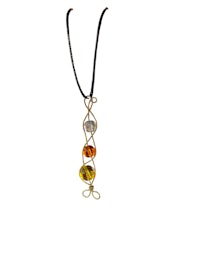 a necklace with a yellow and orange glass pendant