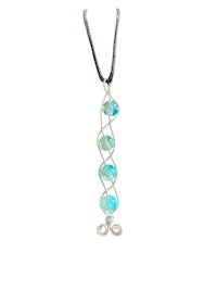 a silver necklace with blue glass beads on it