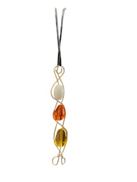 a necklace with a yellow, orange, and black bead on it