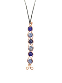 a necklace with a blue stone and copper wire